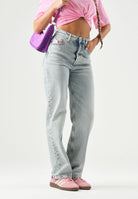 TOMMY JEANS Jeans vintage denim chiaro da donna con lavaggio chiaro effetto used.<BR/> DW0DW23035 1AB TOMMY JEANS 