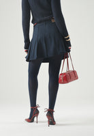 TOMMY JEANS Minigonna a pieghe dark-indigo blu da donna con pieghe frontali <BR/> DW0DW23149 C1G TOMMY JEANS 