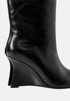 TWENTY FOURHAITCH Stivali neri  per donna con elegante gambale alto e particolare tacco geometrico scultoreo. S0052NER62A . TWENTY FOURHAITCH 