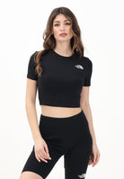 THE NORTH FACE T-shirt crop a manica corta nera da donna con logo NF0A55AOJK31 . THE NORTH FACE 
