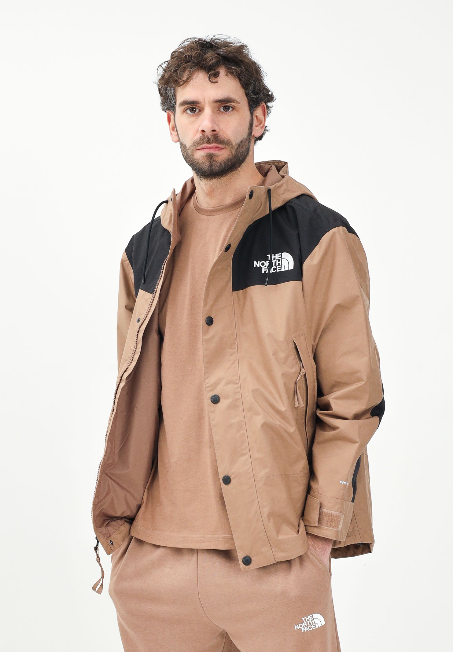 THE NORTH FACE Giacca a vento Reign On marrone e nera da uomo NF0A8B5G58W1 . THE NORTH FACE 