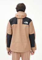THE NORTH FACE Giacca a vento Reign On marrone e nera da uomo NF0A8B5G58W1 . THE NORTH FACE 