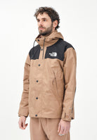 THE NORTH FACE Giacca a vento Reign On marrone e nera da uomo NF0A8B5G58W1 . THE NORTH FACE 