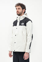 THE NORTH FACE Giacca a vento Reign On bianca e nera da uomo NF0A8B5GROU1 . THE NORTH FACE 