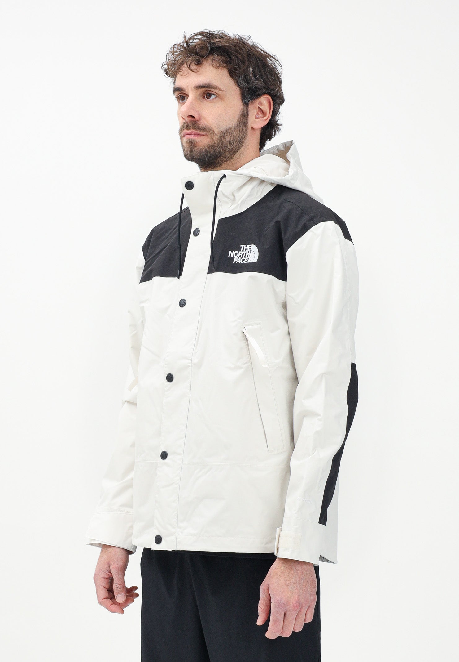 THE NORTH FACE Giacca a vento Reign On bianca e nera da uomo NF0A8B5GROU1 . THE NORTH FACE 