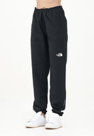 THE NORTH FACE Pantalone antivento Mountain Athletics nero da donna NF0A8BGPJK31 . THE NORTH FACE 