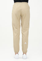 THE NORTH FACE Pantalone antivento Mountain Athletics beige da donna NF0A8BGPLK51 . THE NORTH FACE 