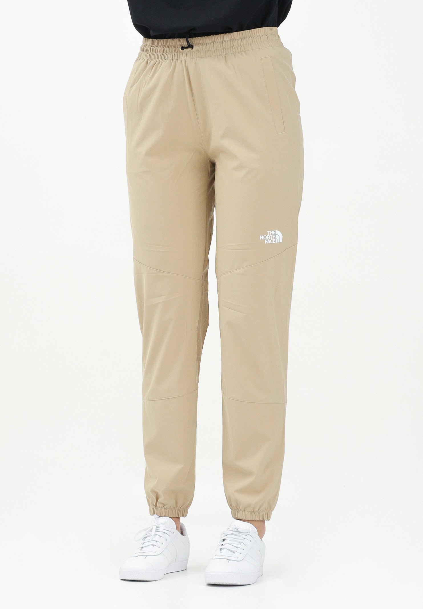 THE NORTH FACE Pantalone antivento Mountain Athletics beige da donna NF0A8BGPLK51 . THE NORTH FACE 