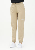 THE NORTH FACE Pantalone antivento Mountain Athletics beige da donna NF0A8BGPLK51 . THE NORTH FACE 