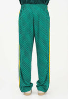 ADIDAS ORIGINALS Pantalone sportivo FIREBIRD LOOSE MONOGRAM verde e giallo da uomo KD0396 . ADIDAS ORIGINALS 