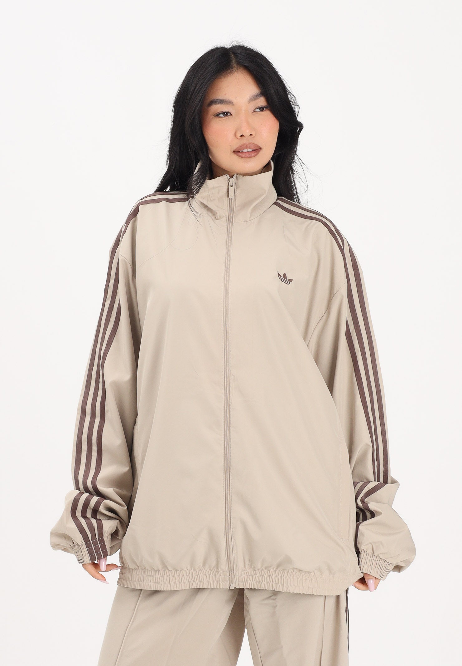 ADIDAS ORIGINALS Giacca a vento Firebird Adilenium beige da donna KD6297 . ADIDAS ORIGINALS 