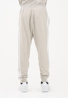 ADIDAS PERFORMANCE Pantalone sportivo ESSENTIALS THREE STRIPES FRENCH TERRY beige da uomo JE6353 . ADIDAS PERFORMANCE 