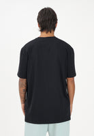 GCDS T-shirt a manica corta nera per uomo e donna con stampa logo C1MEQC041J104 999G GCDS 