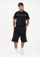 GCDS Shorts sportivo nero per uomo e donna con bande laterali C1MEQL214F004 999B GCDS 