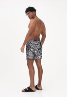 GCDS Shorts mare nero da uomo con stampa logo all-over C1MEQS250T075 999A GCDS 