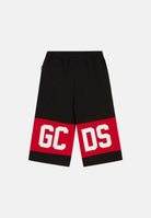 GCDS Shorts nero per bambino e bambina con banda rossa e logo Z0UKQL589F004 999R GCDS 