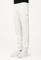 LACOSTE Pantalone sportivo bianco da uomo con rifiniture laterali logate XH0883 70V LACOSTE 