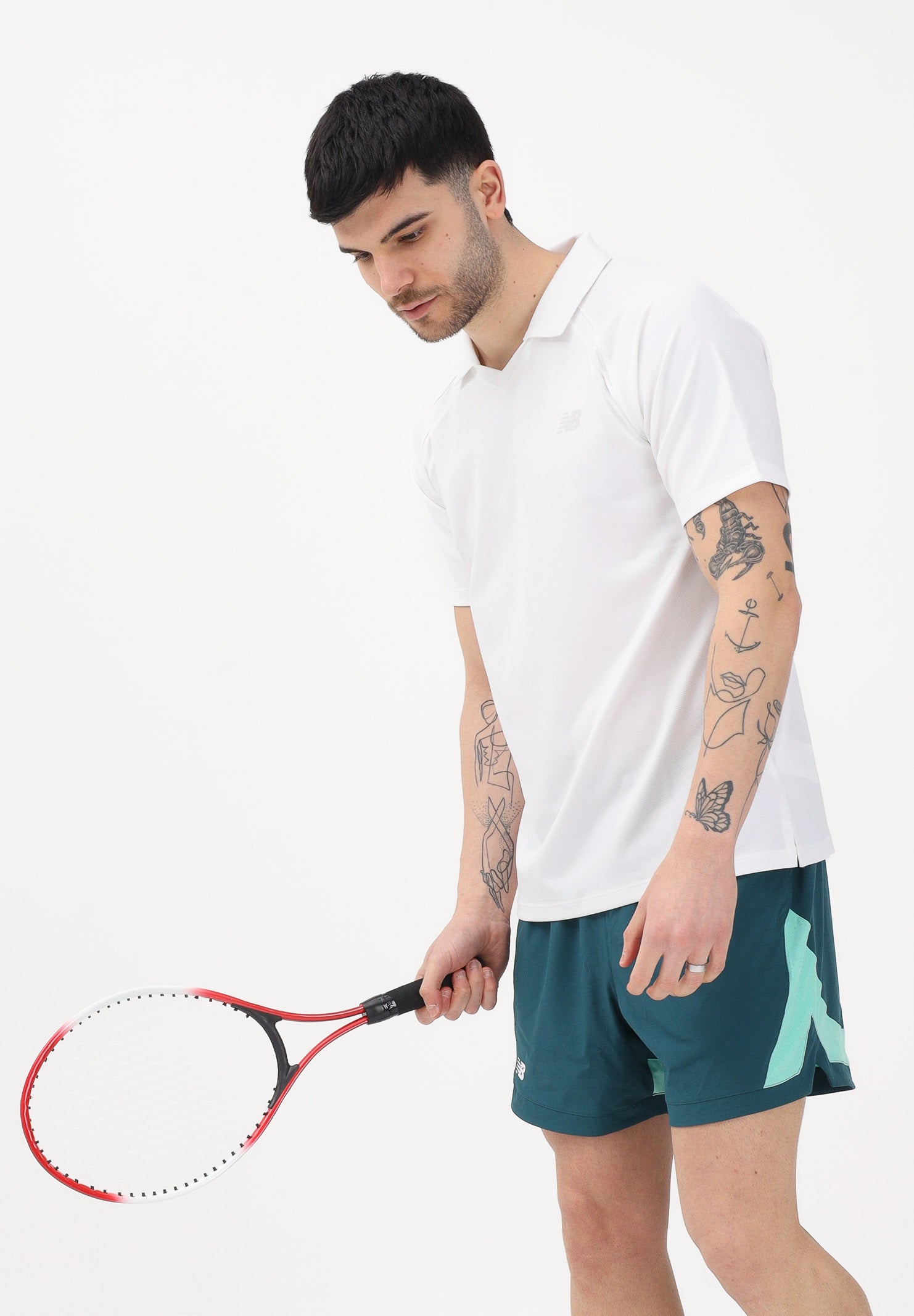 NEW BALANCE Polo a manica corta Tournament Dry bianca da uomo MT61W0HTWT . NEW BALANCE 