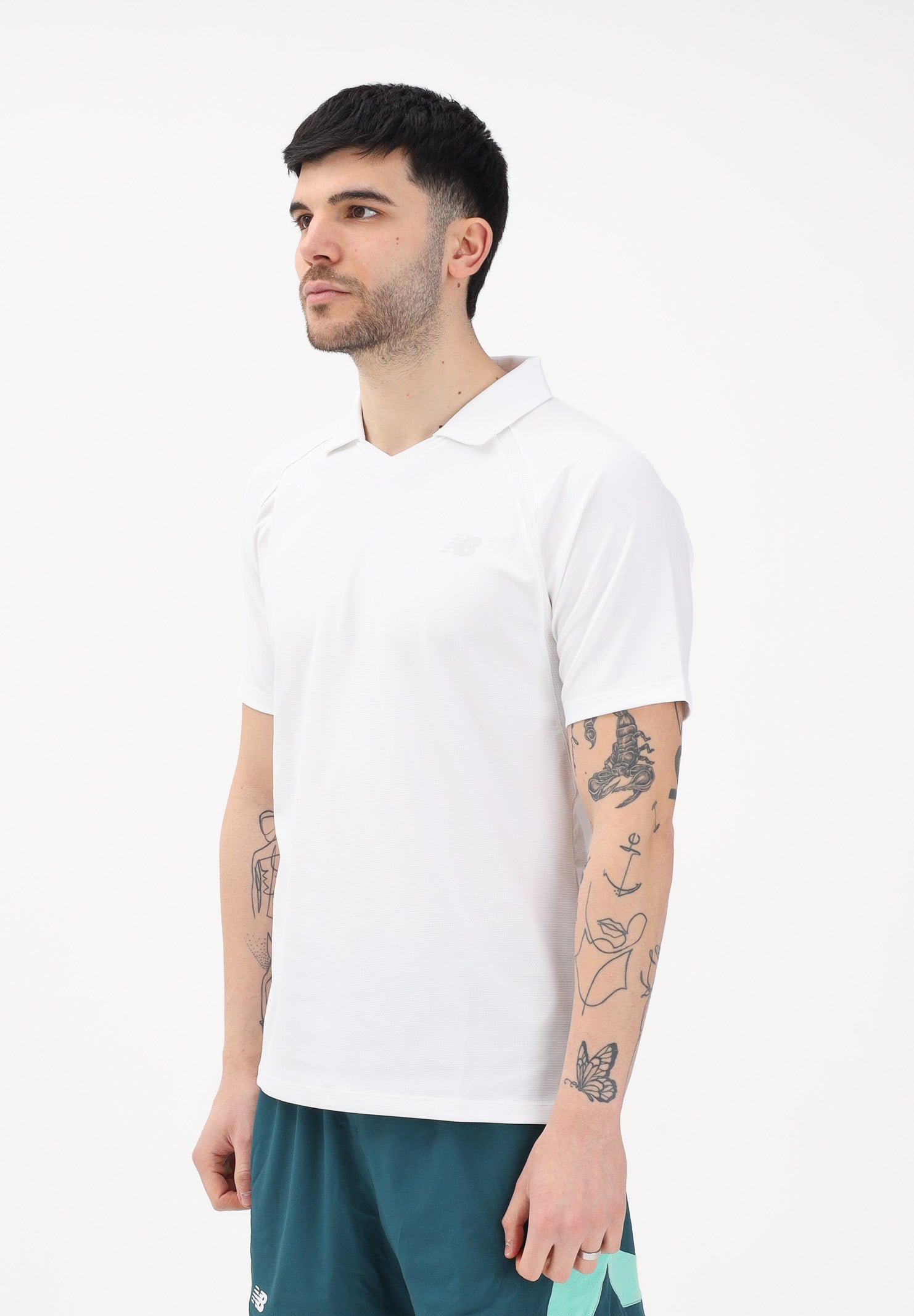 NEW BALANCE Polo a manica corta Tournament Dry bianca da uomo MT61W0HTWT . NEW BALANCE 