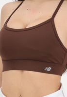 NEW BALANCE Top sportivo NB Essential marrone da donna WB51039ABJ . NEW BALANCE 
