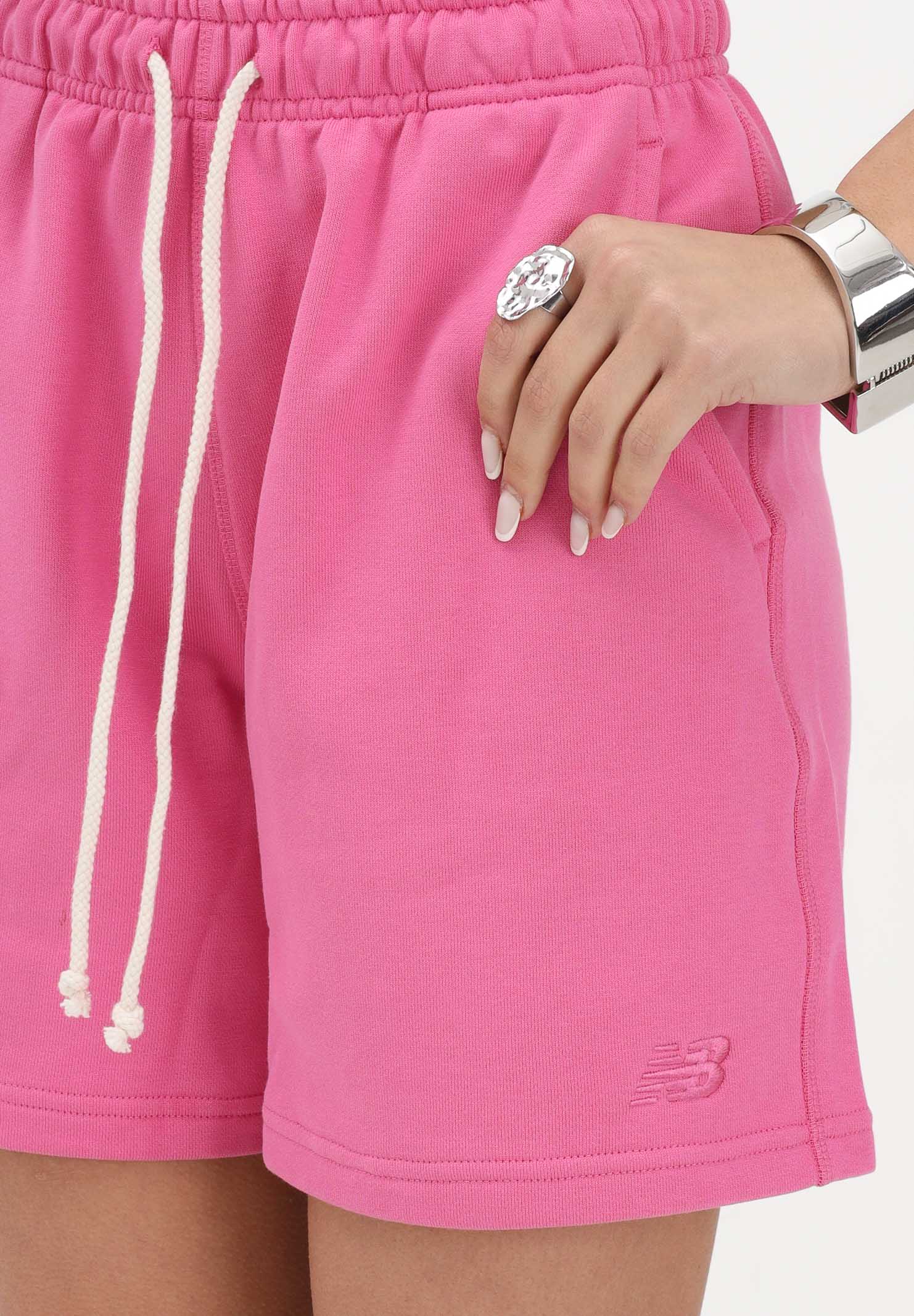 NEW BALANCE Shorts sportivo Athletics French Terry fucsia da donna WS41508AAC . NEW BALANCE 