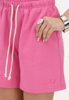 NEW BALANCE Shorts sportivo Athletics French Terry fucsia da donna WS41508AAC . NEW BALANCE 
