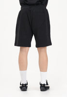 TOMMY HILFIGER Shorts sportivo nero da uomo con banda laterale logata MW0MW42883 BDS TOMMY HILFIGER 