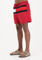 TOMMY HILFIGER Shorts mare rosso da uomo con bandiera Hilfiger UM0UM03474 XKC TOMMY HILFIGER 