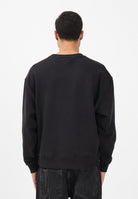 TOMMY JEANS Felpa girocollo nera da uomo stile '90s con distintivo DM0DM22384 BDS TOMMY JEANS 