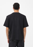 TOMMY JEANS T-shirt a manica corta nera da uomo con stampa logo effetto consumato DM0DM22463 BDS TOMMY JEANS 