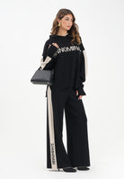 HINNOMINATE Pantalone in maglia nero da donna con banda laterale logata HMABW02131 NE01 HINNOMINATE 