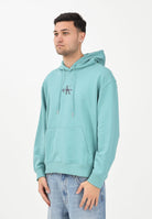 CALVIN KLEIN JEANS Felpa con cappuccio verde acqua da uomo con logo LV04RD243G2IR . CALVIN KLEIN JEANS 