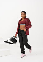 PUMA Tuta Poly bordeaux e nera da donna 688159 96 PUMA 