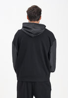 GCDS Felpa con zip nera per uomo e donna caratterizzata da inserti in tessuto tecnico e logo B1XM2001JI1 99 GCDS 