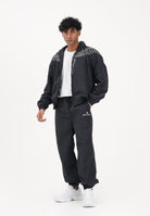 MARCELO BURLON COUNTY OF MILAN Pantalone sportivo nero da uomo con logo S6CMMAPA076 110 MARCELO BURLON COUNTY OF MILAN 