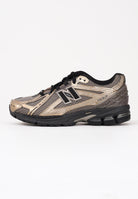 NEW BALANCE Sneakers 1906R nere, beige e oro per uomo e donna U1906RCJ  NEW BALANCE 