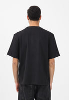 TOMMY JEANS T-shirt a manica corta nera da uomo con stampa logo effetto consumato DM0DM22463 BDS TOMMY JEANS 