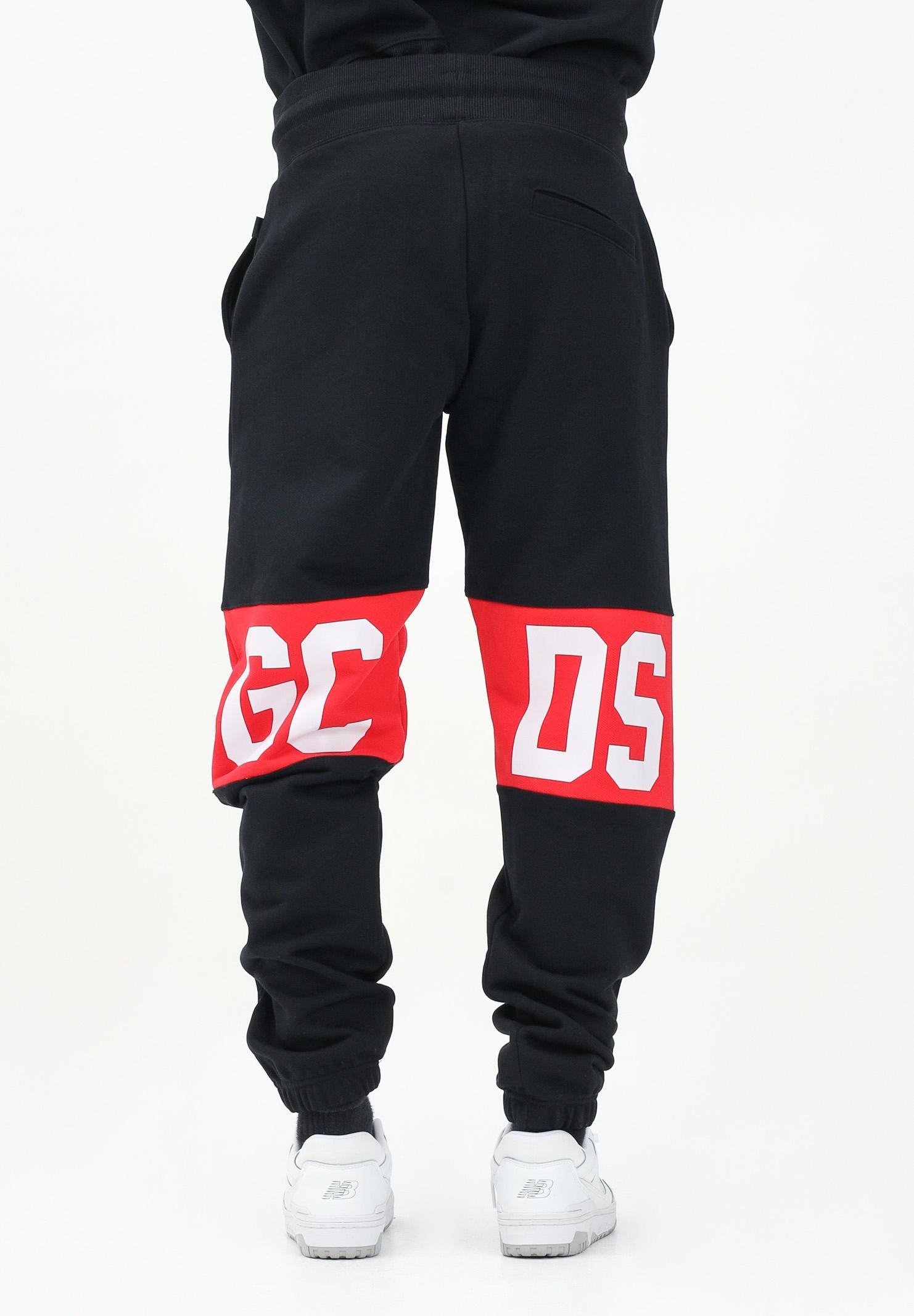 GCDS Pantalone sportivo nero per uomo e donna con banda logo Z0MLQI209F004 999R GCDS 