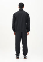 PUMA Tuta nera da uomo con piping intrecciato 684849 01 PUMA 