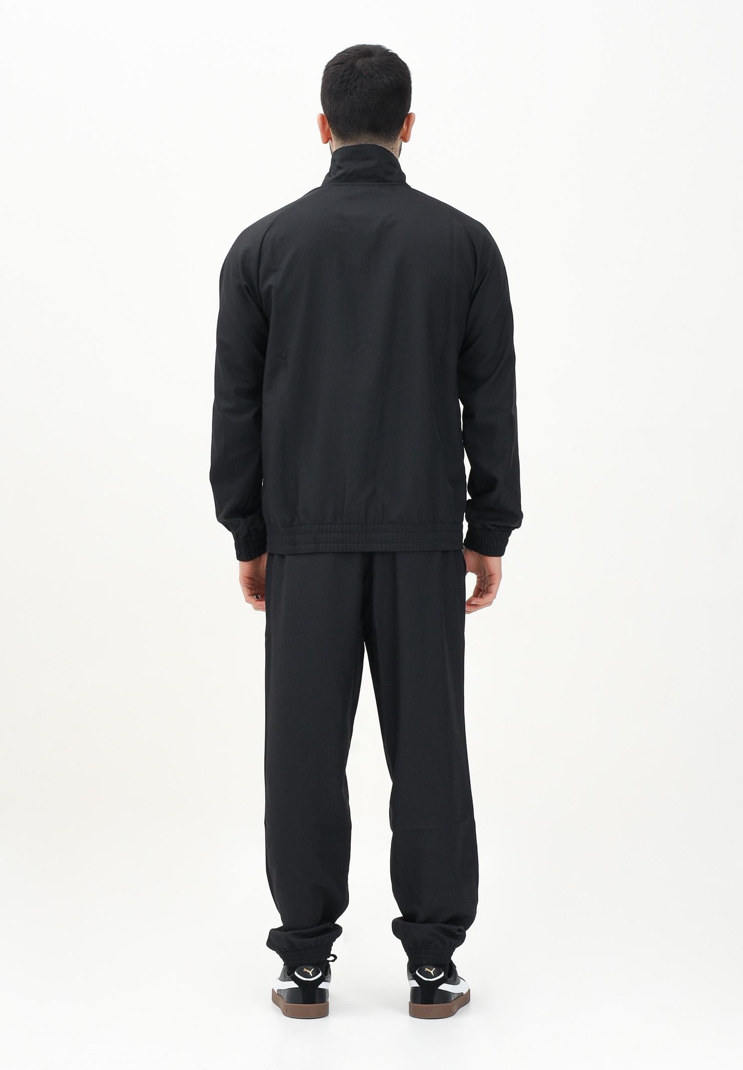 PUMA Tuta nera da uomo con piping intrecciato 684849 01 PUMA 