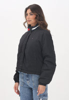 TOMMY JEANS Giacca trapuntata nera da donna con logo Tommy Jeans DW0DW21436BDS  TOMMY JEANS 