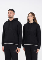 GCDS Felpa con cappuccio nera per uomo e donna rifinita da logo impresso B2EW1905JD1 99 GCDS 