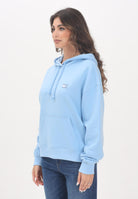 TOMMY JEANS Felpa con cappuccio azzurra da donna rifinita da logo DW0DW19414C1T  TOMMY JEANS 