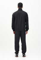 PUMA Tuta nera da uomo con piping intrecciato 684849 01 PUMA 