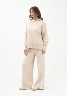 HINNOMINATE Pantalone in maglia beige da donna con banda laterale logata HMABW02131 BE11 HINNOMINATE 