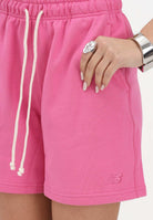 NEW BALANCE Shorts sportivo Athletics French Terry fucsia da donna WS41508AAC . NEW BALANCE 