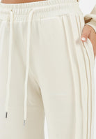 HINNOMINATE Pantalone sportivo panna da donna con nervature laterali HMABW01995 BI04 HINNOMINATE 