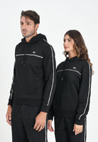 LACOSTE Felpa con cappuccio nera per uomo e donna rifinita da righe logate SH9808 031 LACOSTE 