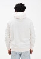 TOMMY JEANS Felpa con cappuccio panna da uomo caratterizzata da un badge Tommy DM0DM20738YBH  TOMMY JEANS 