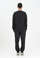 PUMA Tuta sportiva nera da donna con logo 688160 01 PUMA 